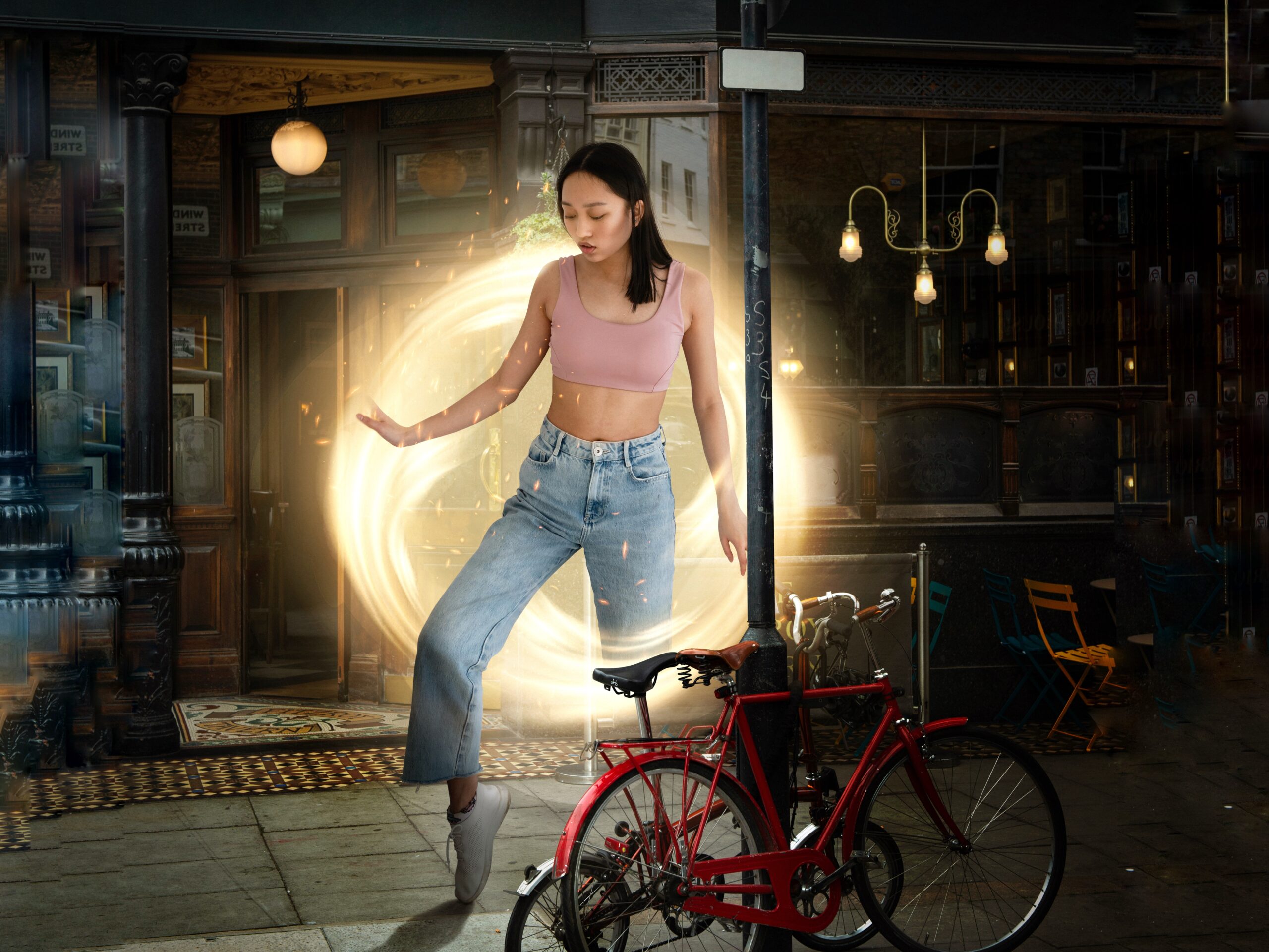 Young woman in a quaint European city stepping out of a vortex transformed